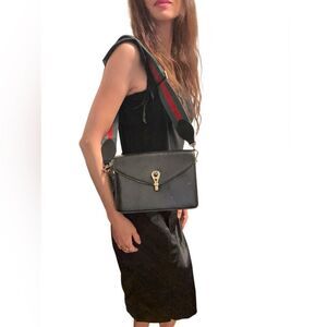 Gucci Black and Gold Leather Clutch